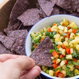 Ini summery sweet and savory pineapple salsa is the one thing you should be eating with your chips.
